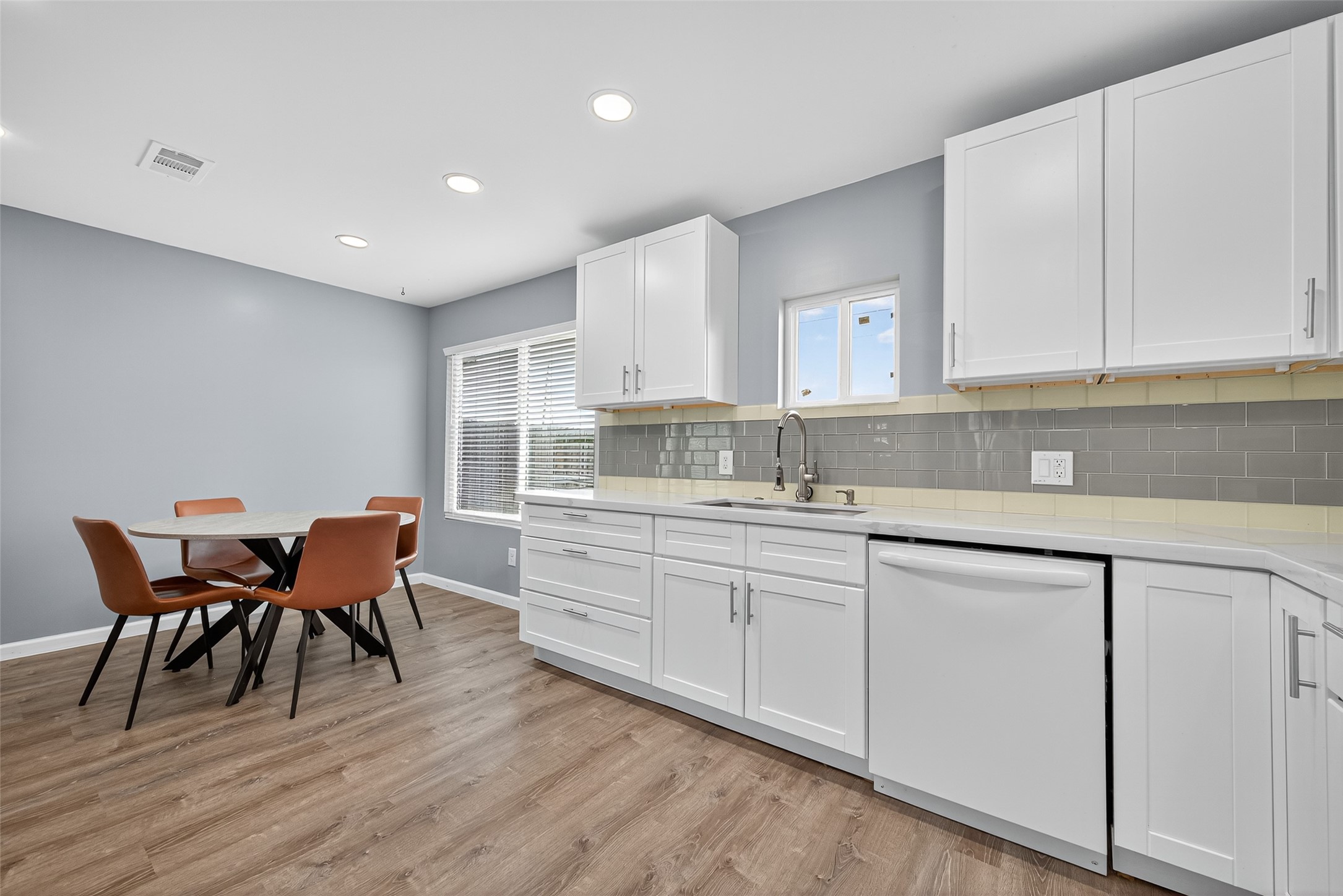 10106 Shadow Pine Drive Houston, TX 77070 - Photo 21 of 39 a kitchen with stainless steel appliances granite countertop a white cabinets and wooden floors