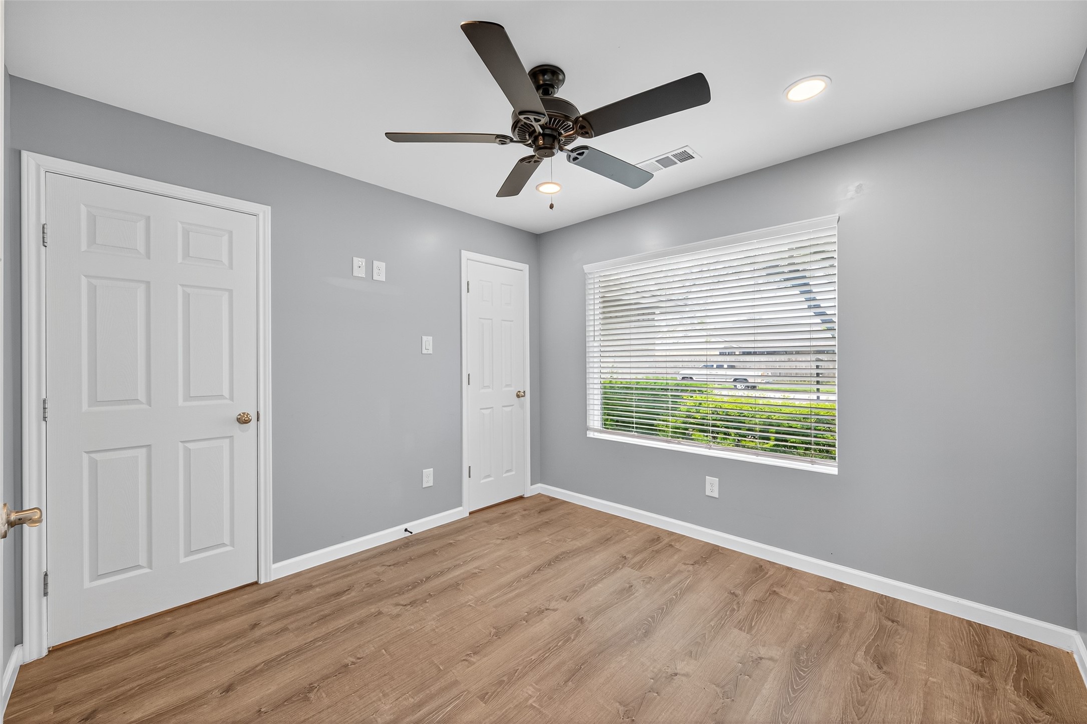 10106 Shadow Pine Drive Houston, TX 77070 - Photo 22 of 39 a view of an empty room with wooden floor and a window
