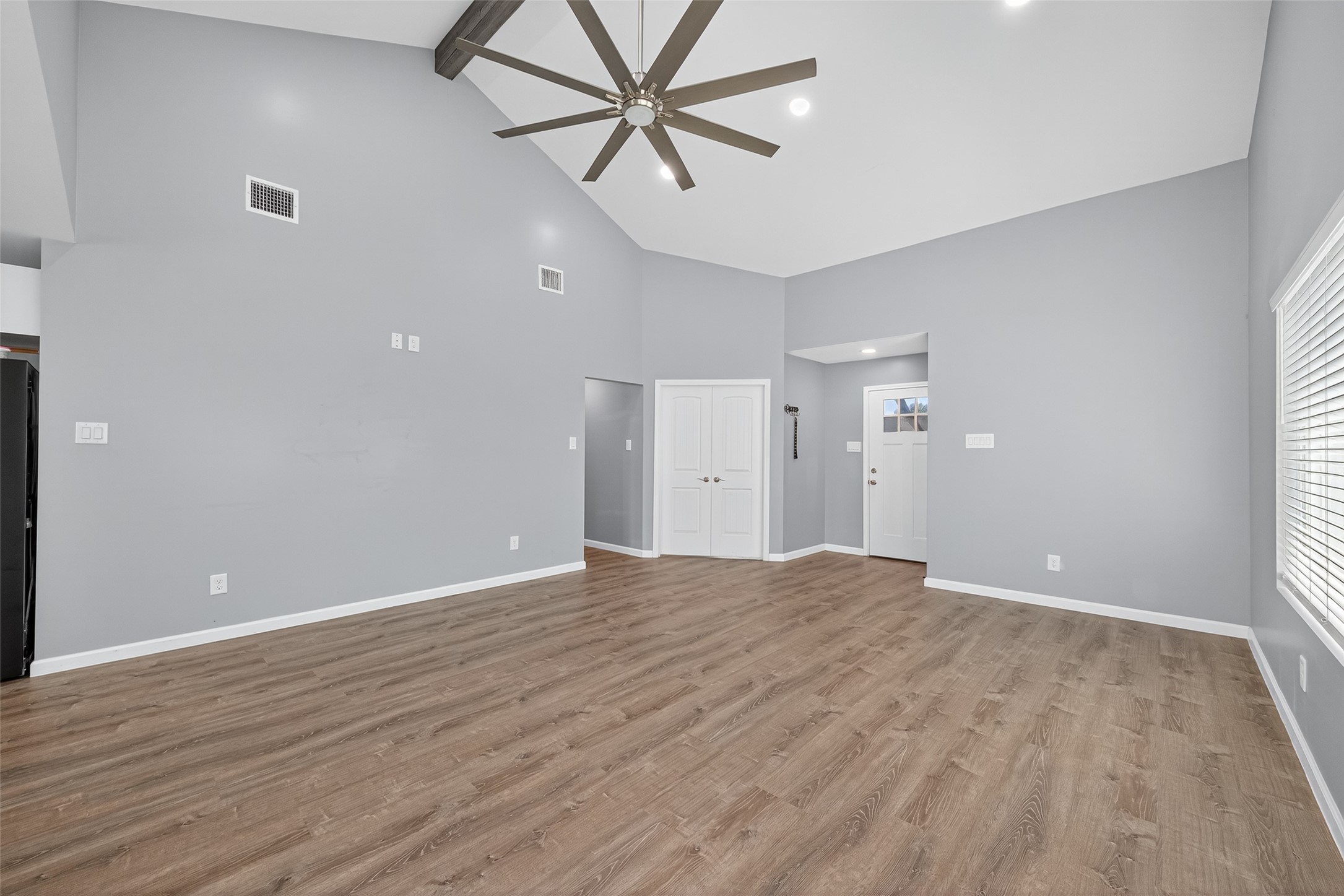 10106 Shadow Pine Drive Houston, TX 77070 - Photo 5 of 39 wooden floor in an empty room with a window