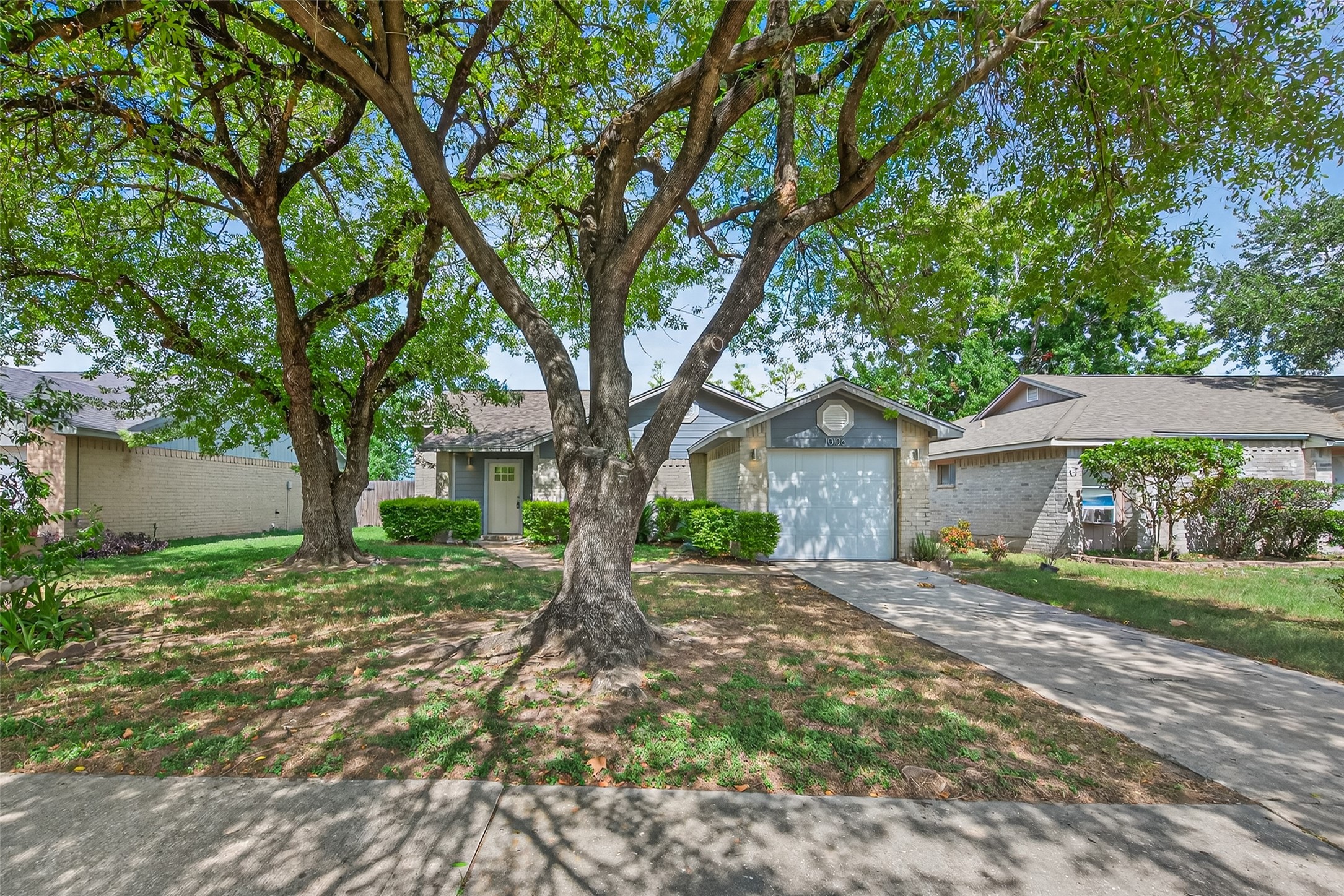 10106 Shadow Pine Drive Houston, TX 77070 - Photo 7 of 39 a view of a house with a tree in the yard