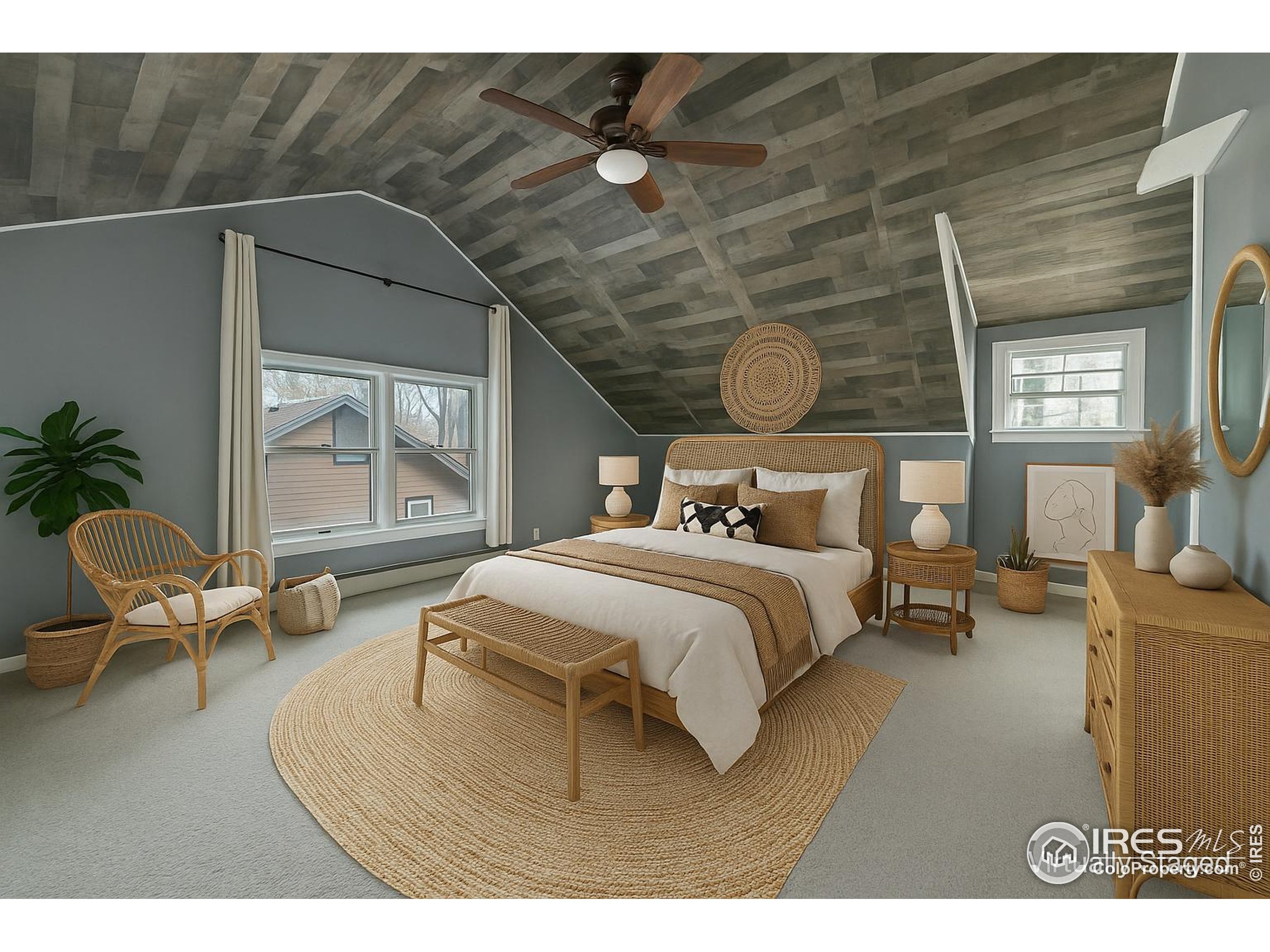 405 Maple Street Fort Morgan, CO 80701 - Photo 6 of 10 a bedroom with a bed and wooden floor