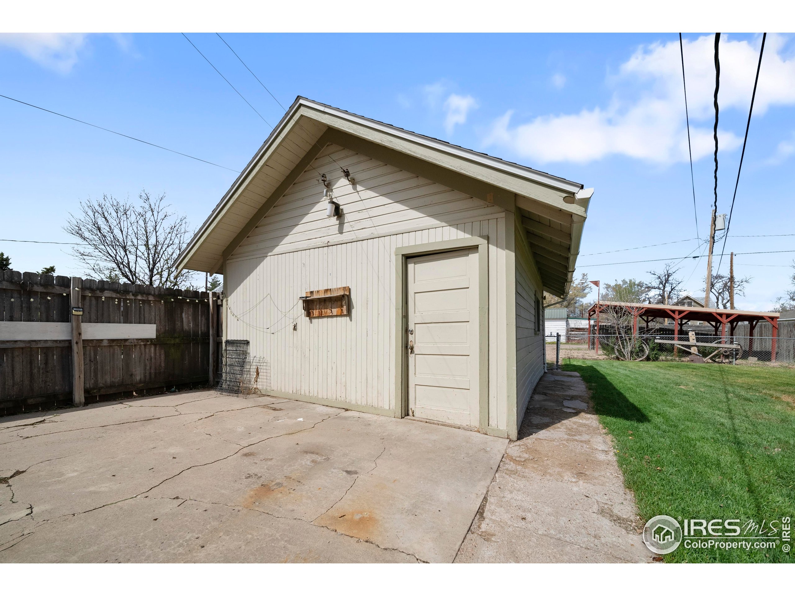 405 Maple Street Fort Morgan, CO 80701 - Photo 8 of 10 a view of backyard of house and car parked