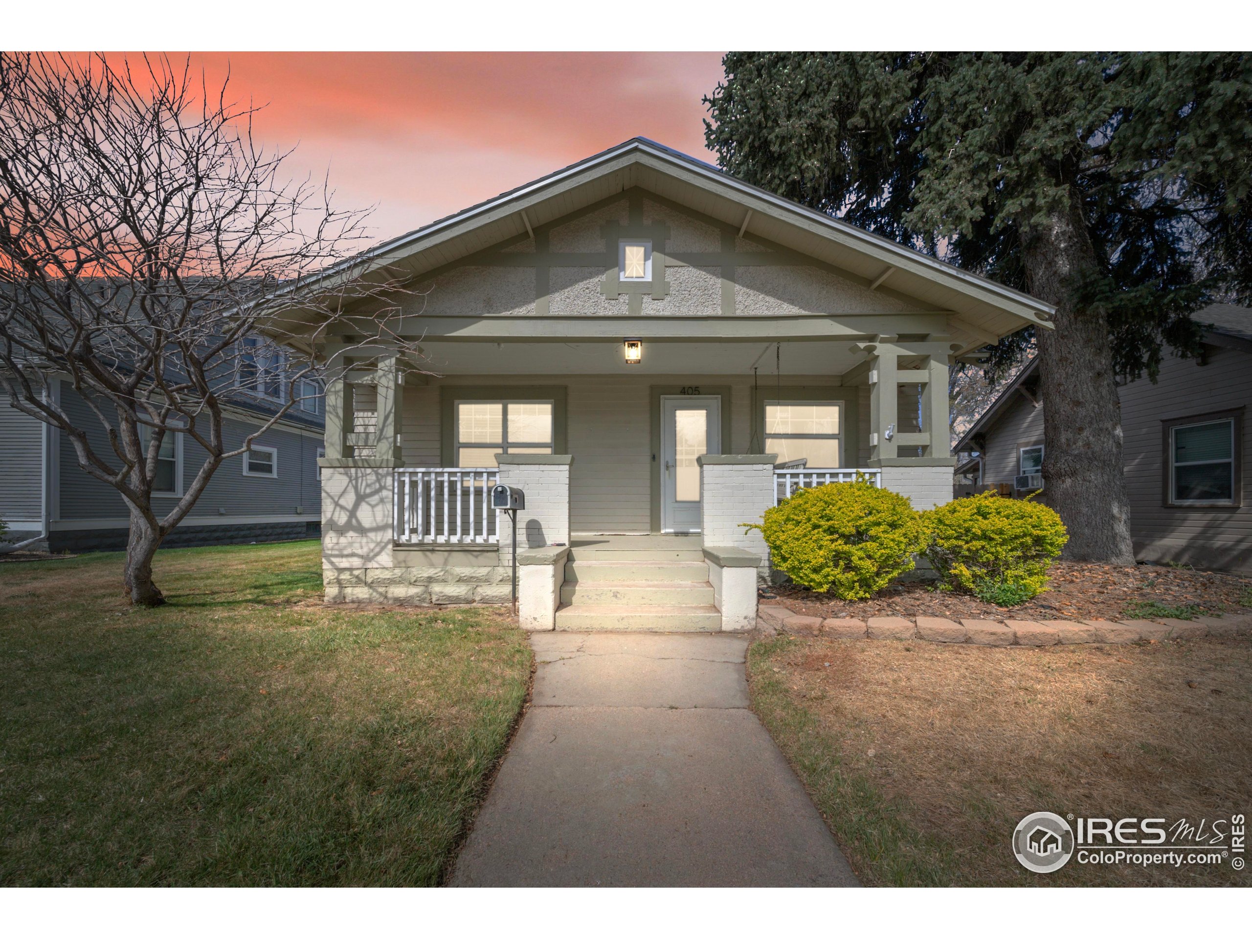 405 Maple Street Fort Morgan, CO 80701 - Photo 10 of 10 a front view of a house with a garden