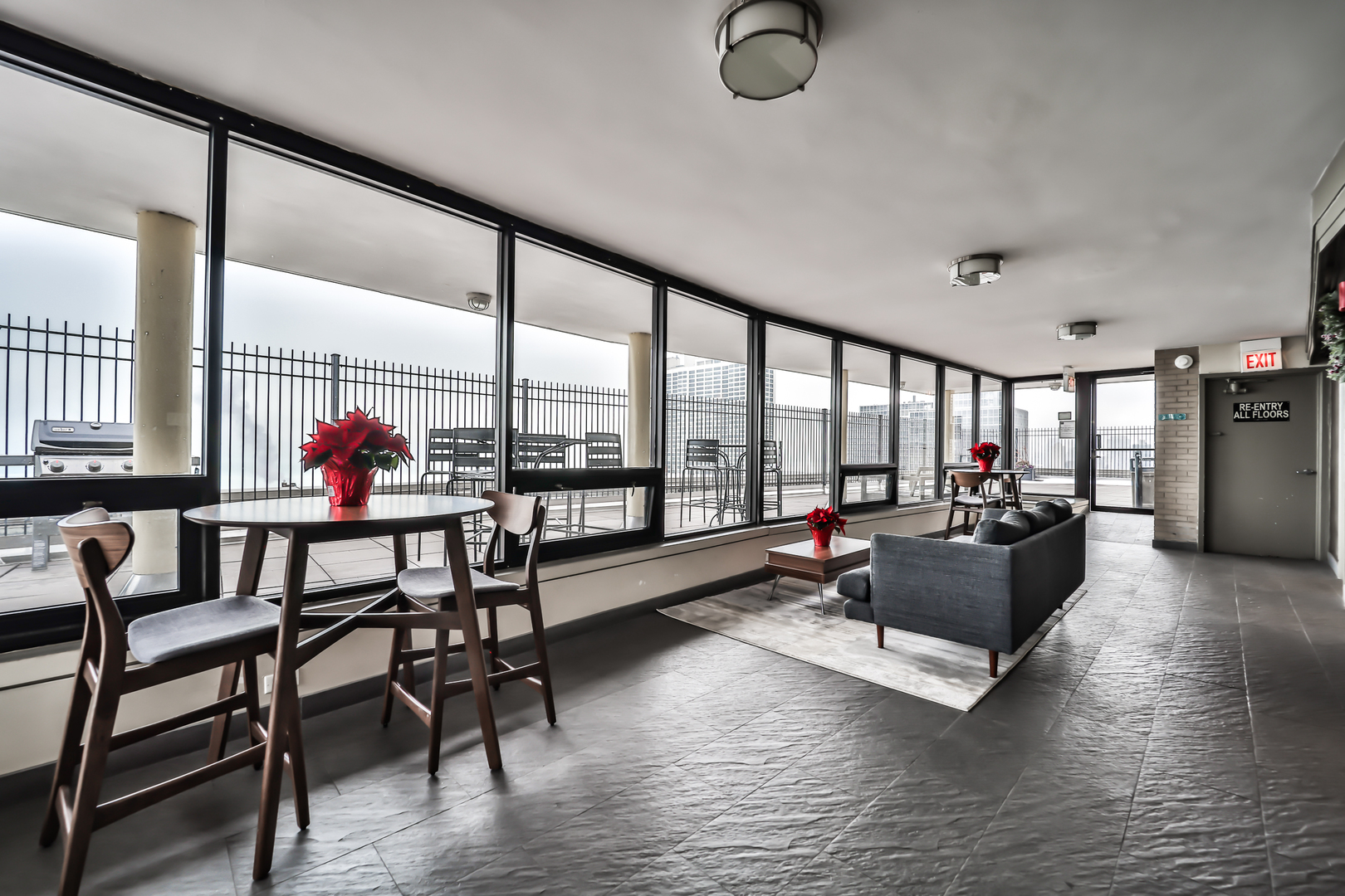 2930 North Sheridan Road, Unit 1401 Chicago, IL 60657 - Photo 16 of 23 a living room with furniture and a large window