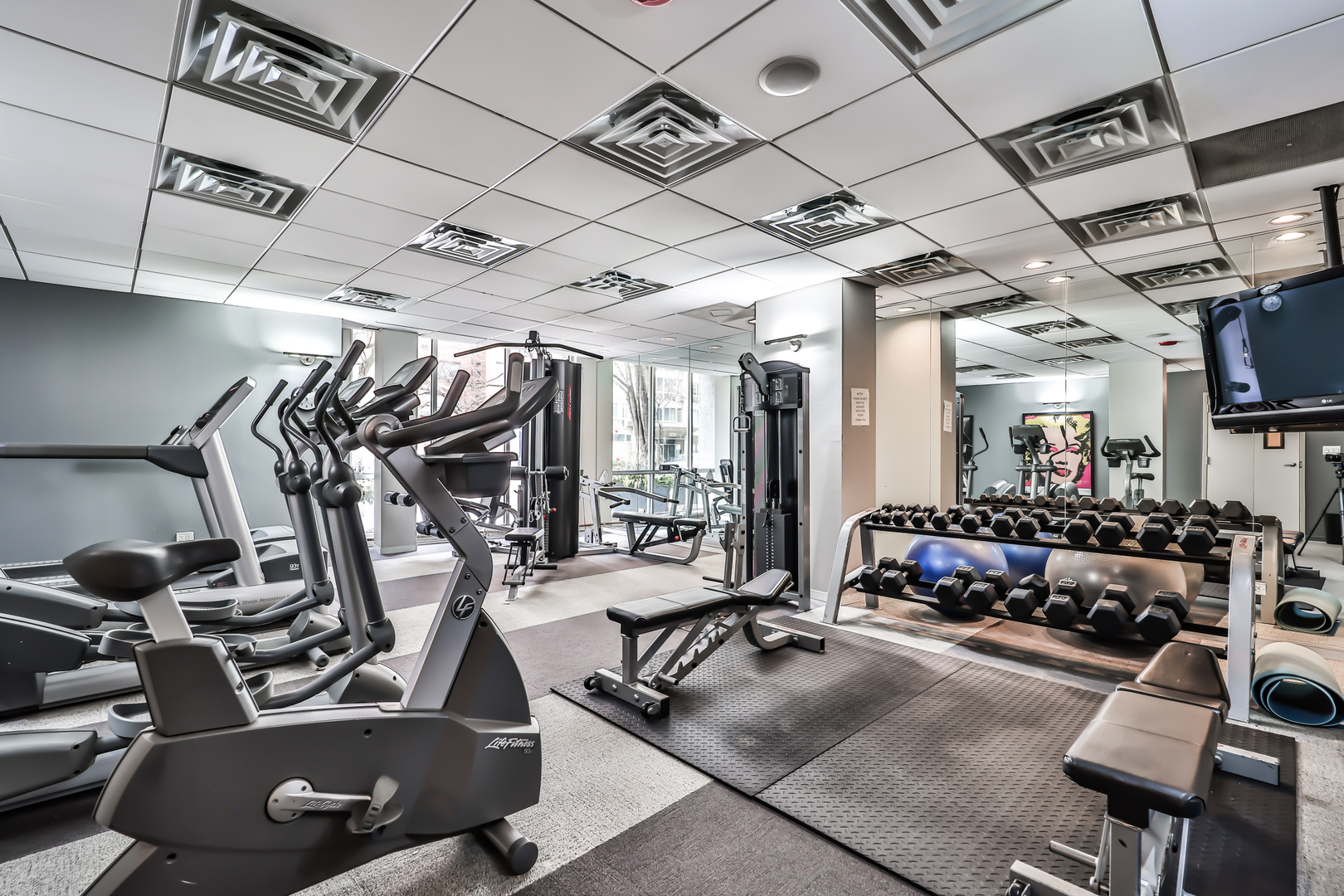 2930 North Sheridan Road, Unit 1401 Chicago, IL 60657 - Photo 17 of 23 a view of a room with gym equipment