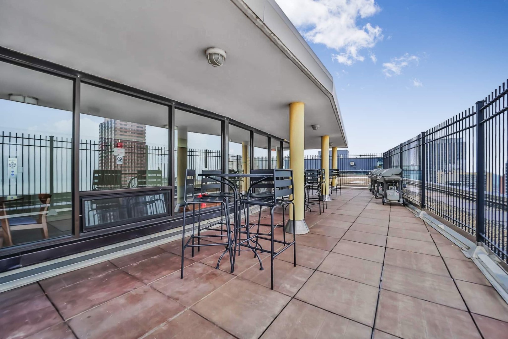 2930 North Sheridan Road, Unit 1401 Chicago, IL 60657 - Photo 23 of 23 a room with lots of glass windows