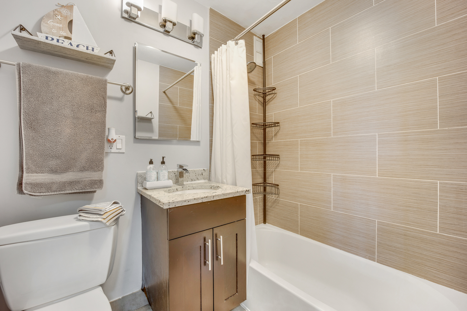 2930 North Sheridan Road, Unit 1401 Chicago, IL 60657 - Photo 10 of 23 a bathroom with a sink a toilet and shower