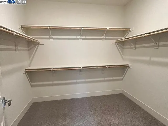 a view of an empty walk in closet