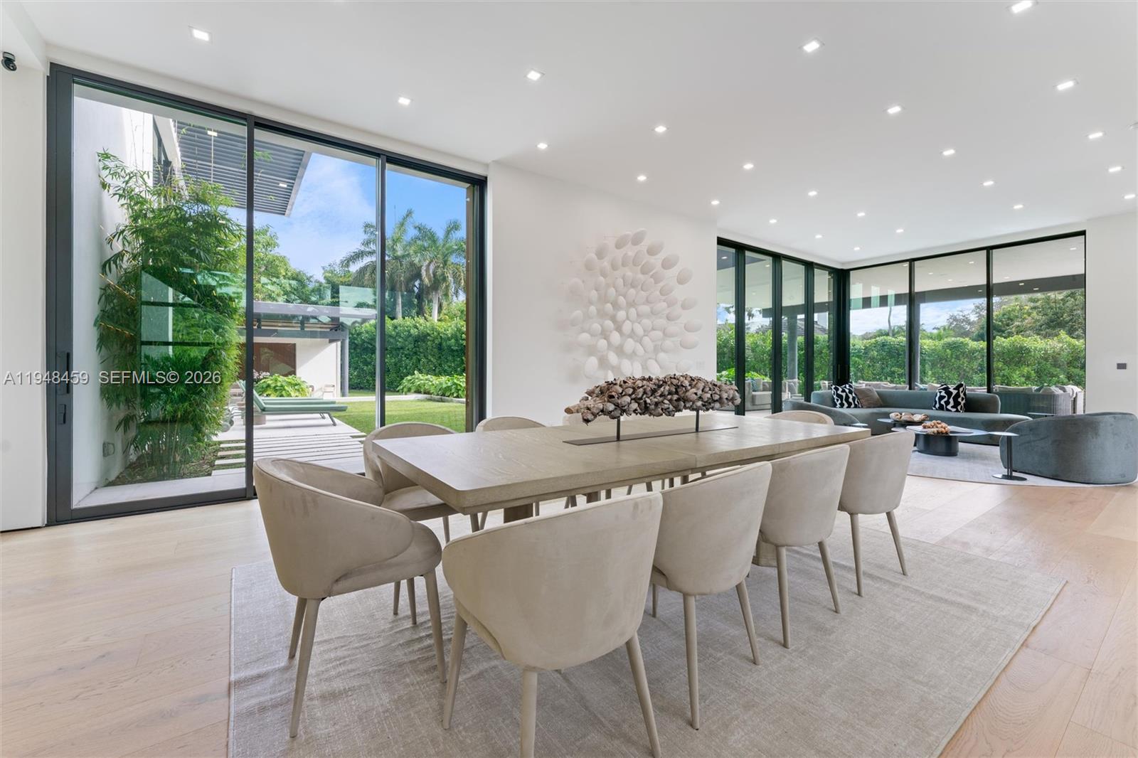 5845 Southwest 130th Terrace Pinecrest, FL 33156 - Photo 19 of 44 a dining hall with stainless steel appliances granite countertop a table and chairs with the ocean view