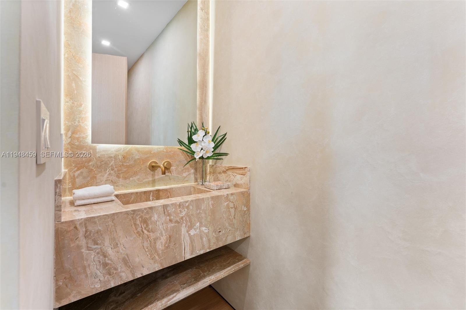 5845 Southwest 130th Terrace Pinecrest, FL 33156 - Photo 21 of 44 a bath room with a sink and a mirror