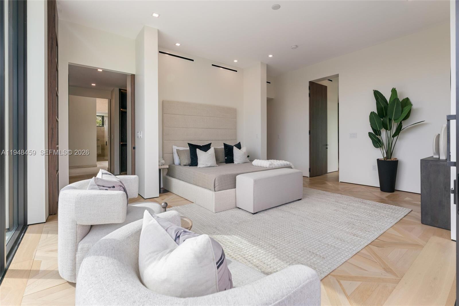 5845 Southwest 130th Terrace Pinecrest, FL 33156 - Photo 33 of 44 a living room with furniture and a potted plant