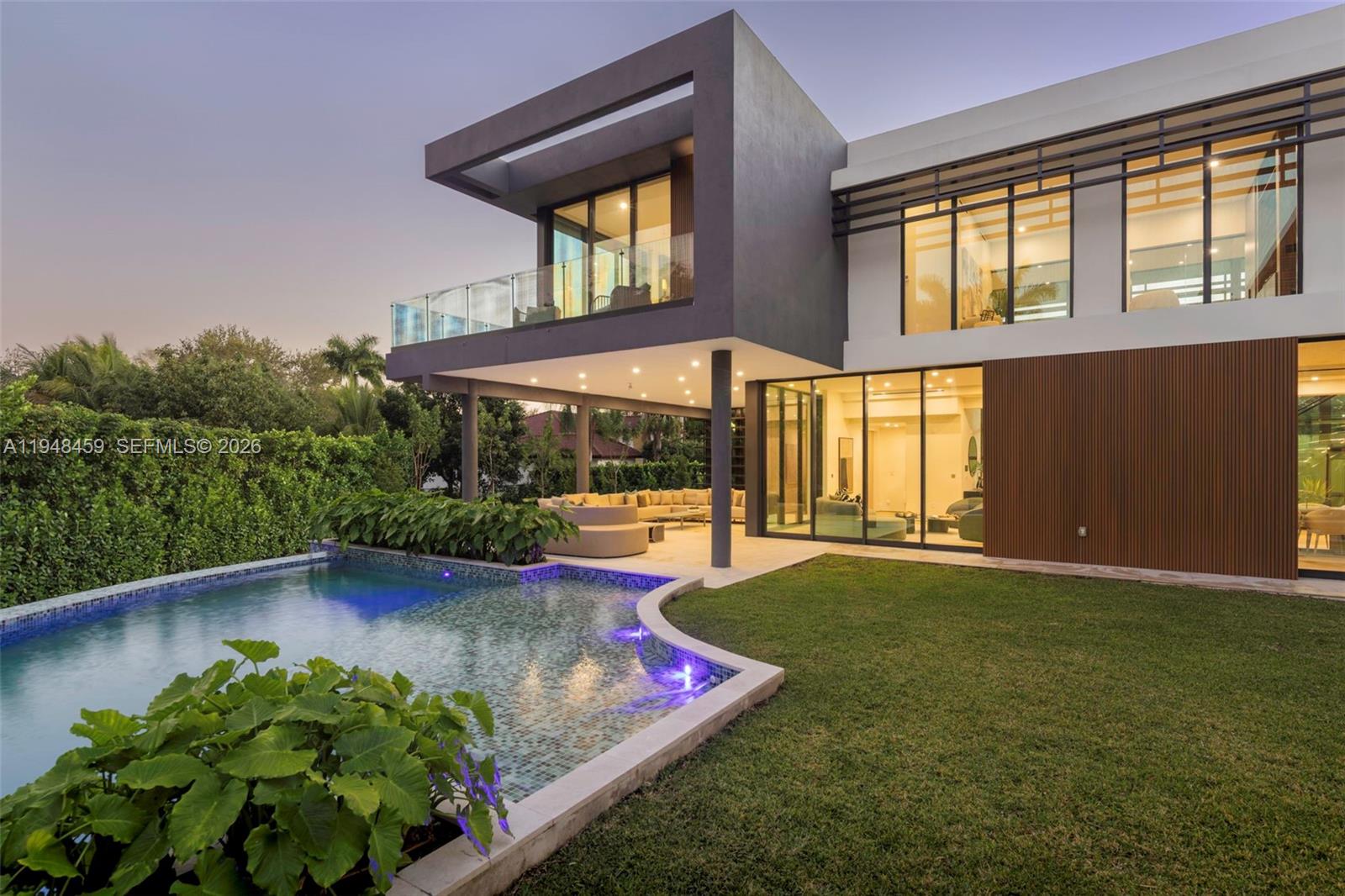 5845 Southwest 130th Terrace Pinecrest, FL 33156 - Photo 4 of 55 front view of a house with a yard