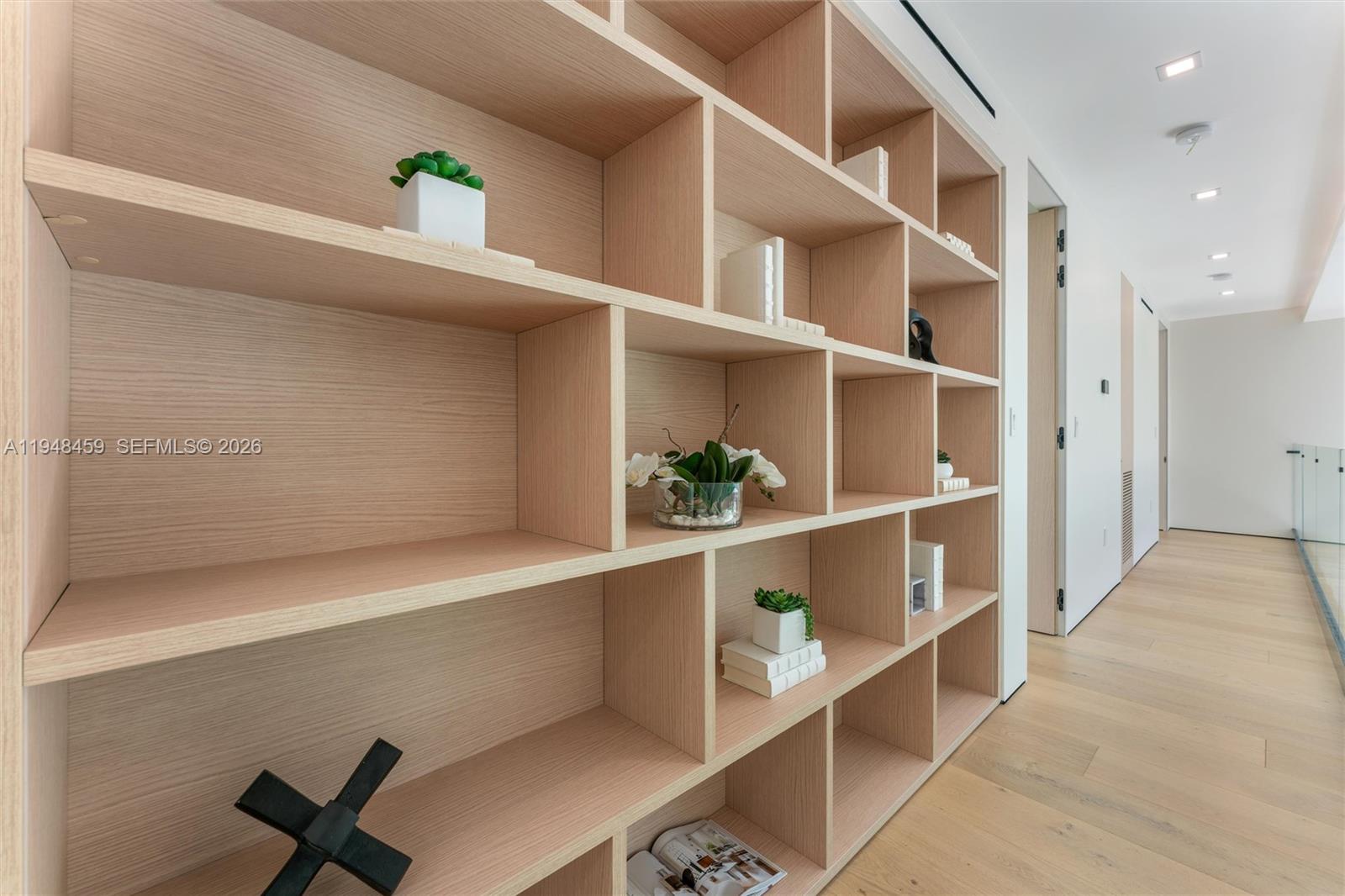 5845 Southwest 130th Terrace Pinecrest, FL 33156 - Photo 45 of 55 a workspace with a bookshelf