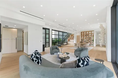 a kitchen with stainless steel appliances granite countertop sink stove and wooden cabinets