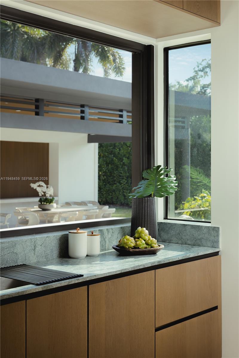 5845 Southwest 130th Terrace Pinecrest, FL 33156 - Photo 9 of 55 a kitchen with a sink and wooden floor