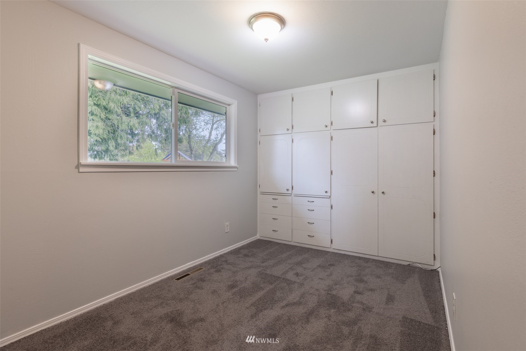 8705 Terrace Road Southwest Lakewood, WA 98498 - Photo 19 of 28 an empty room with a window
