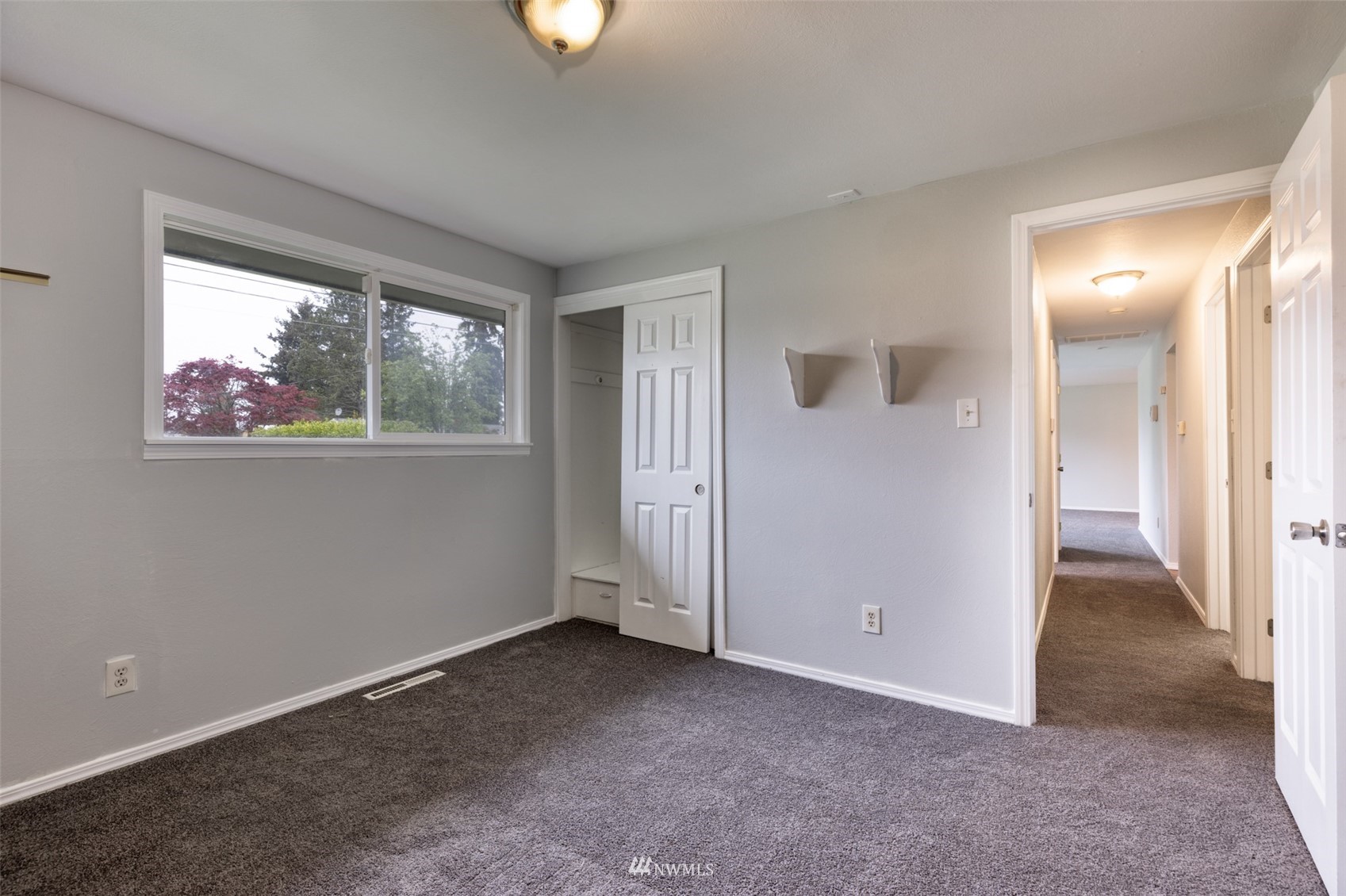 8705 Terrace Road Southwest Lakewood, WA 98498 - Photo 22 of 28 an empty room with windows and closet