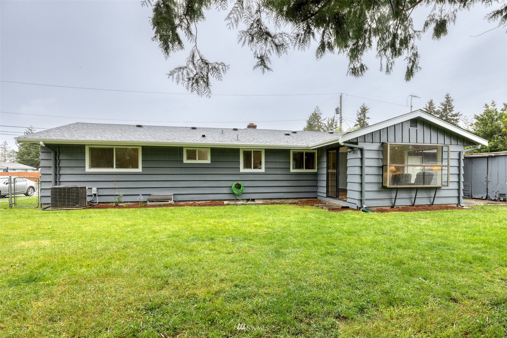 8705 Terrace Road Southwest Lakewood, WA 98498 - Photo 24 of 28 a front view of a house with a garden