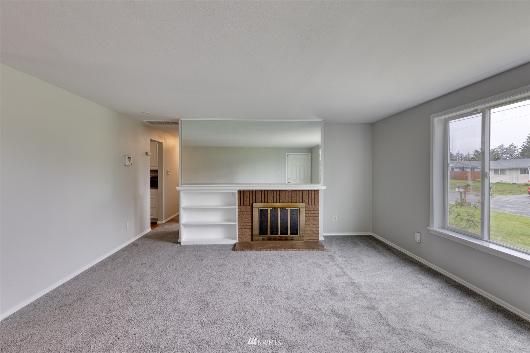8705 Terrace Road Southwest Lakewood, WA 98498 - Photo 7 of 28 an empty room with windows