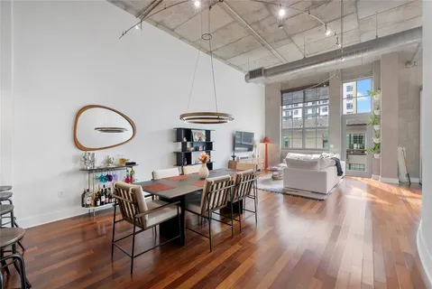 a view of a dining room with furniture window and wooden floor