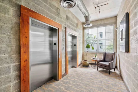 a living room with furniture and a entry gate