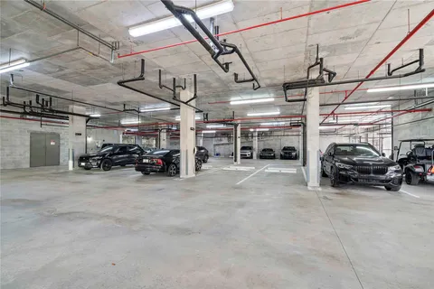 a view of parking garage with cars