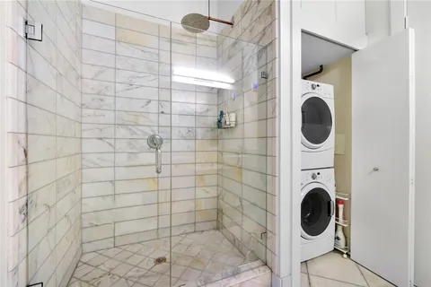 a bathroom with a sink a toilet and a shower