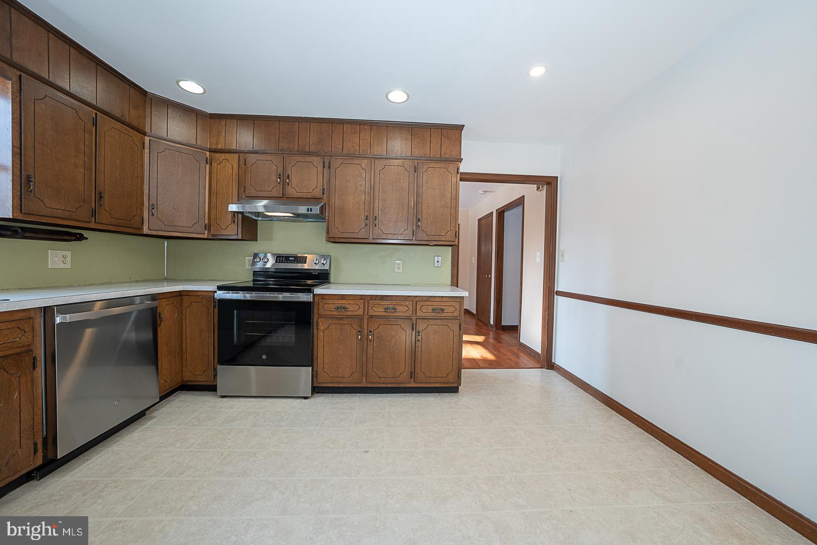 244 South Bonsall Road Coatesville, PA 19320 - Photo 15 of 48 a kitchen with stainless steel appliances granite countertop a stove a sink and a refrigerator