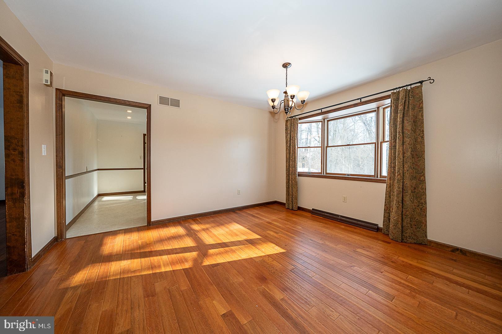 244 South Bonsall Road Coatesville, PA 19320 - Photo 20 of 48 a view of an empty room with wooden floor and a window