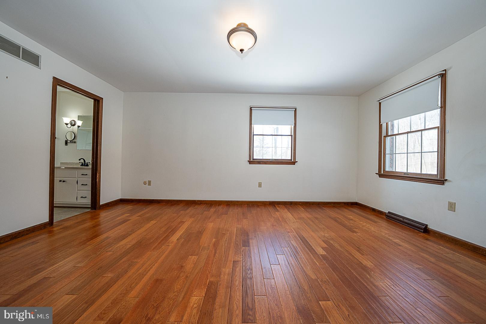 244 South Bonsall Road Coatesville, PA 19320 - Photo 25 of 48 an empty room with wooden floor and windows