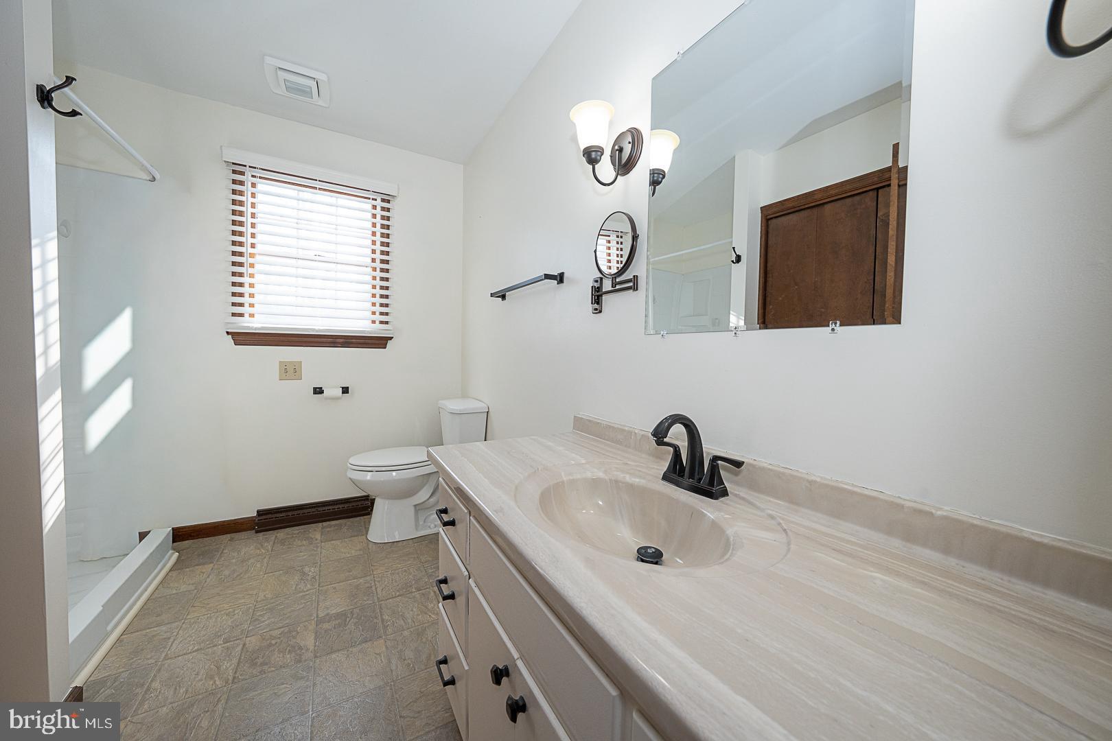 244 South Bonsall Road Coatesville, PA 19320 - Photo 26 of 48 a bathroom with a sink and a mirror