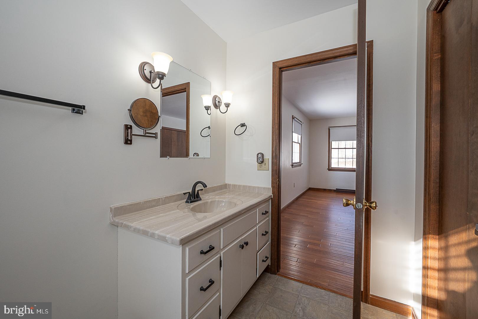 244 South Bonsall Road Coatesville, PA 19320 - Photo 28 of 48 a bathroom with a sink and a mirror