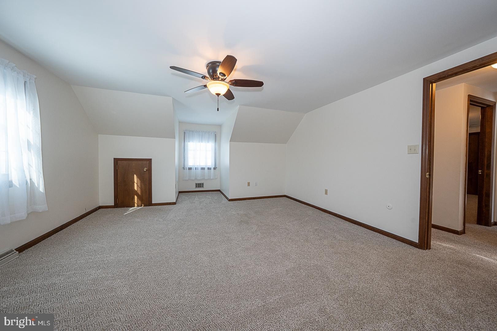 244 South Bonsall Road Coatesville, PA 19320 - Photo 38 of 48 a view of a big room with chandelier fan and windows