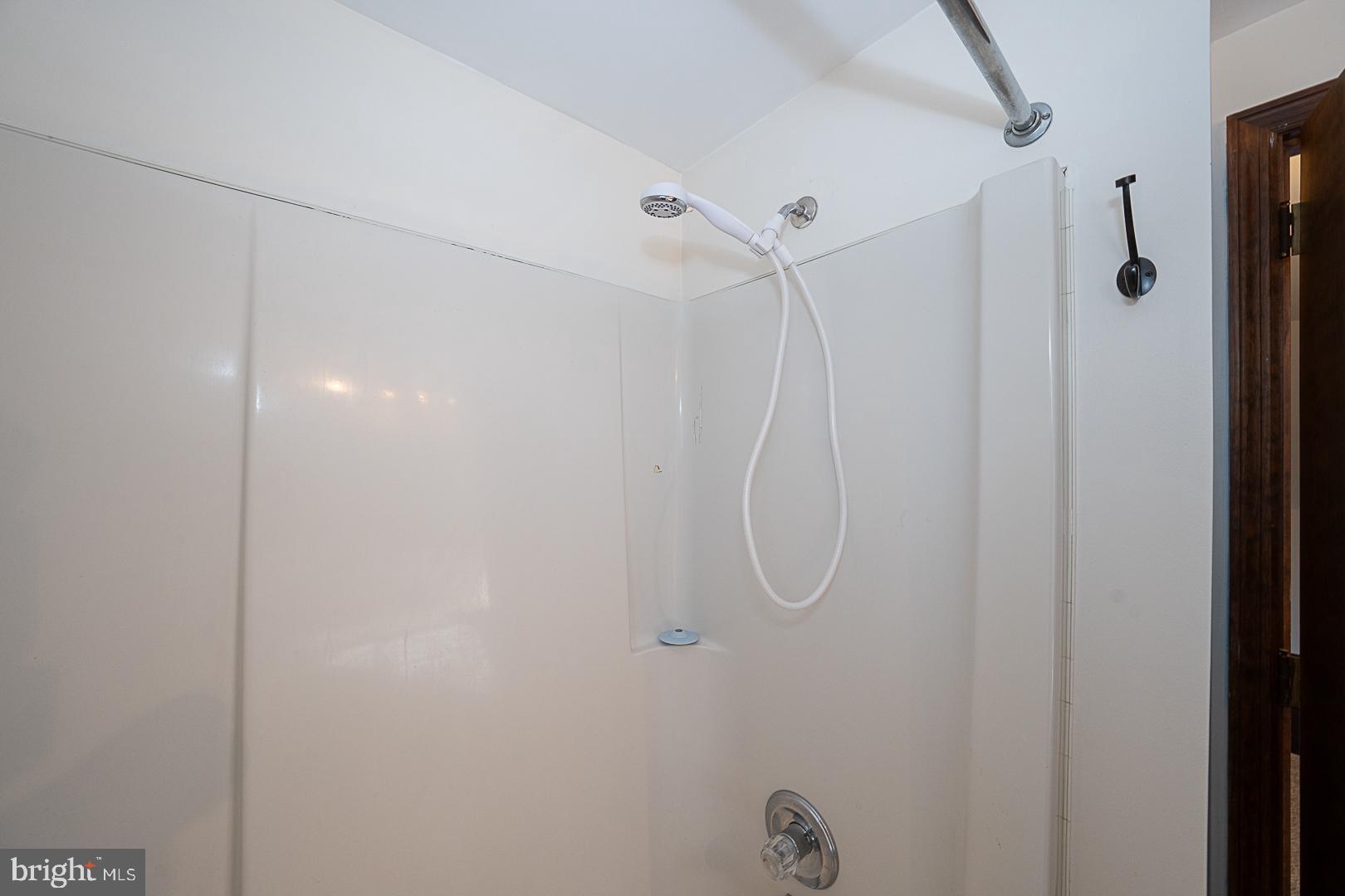 244 South Bonsall Road Coatesville, PA 19320 - Photo 40 of 48 a bathroom with a glass shower door