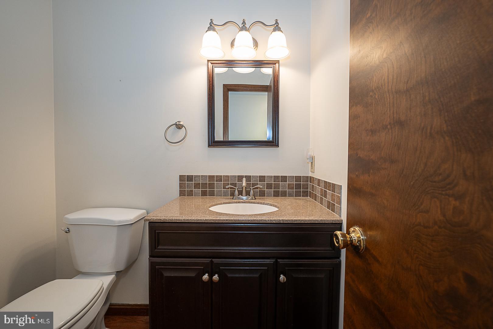 244 South Bonsall Road Coatesville, PA 19320 - Photo 9 of 48 a bathroom with a sink toilet and mirror