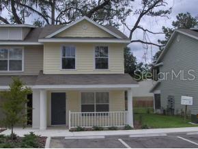 4288 Southwest 22nd Lane Gainesville, FL 32607 - Photo 1 of 1 a front view of a house with garden