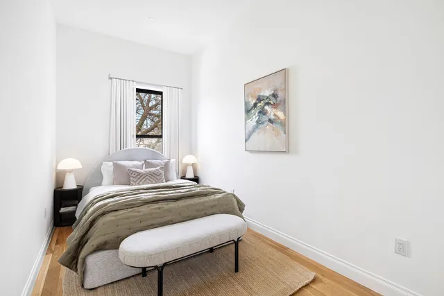 a bathroom with a toilet a sink and a mirror