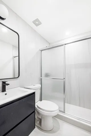 a bedroom with a bed and a lamp