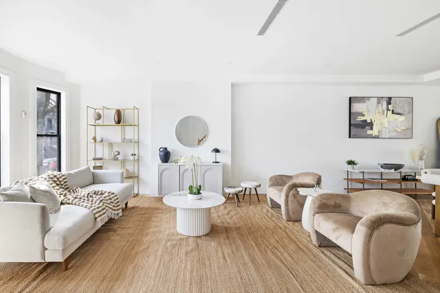 a living room with furniture and a table