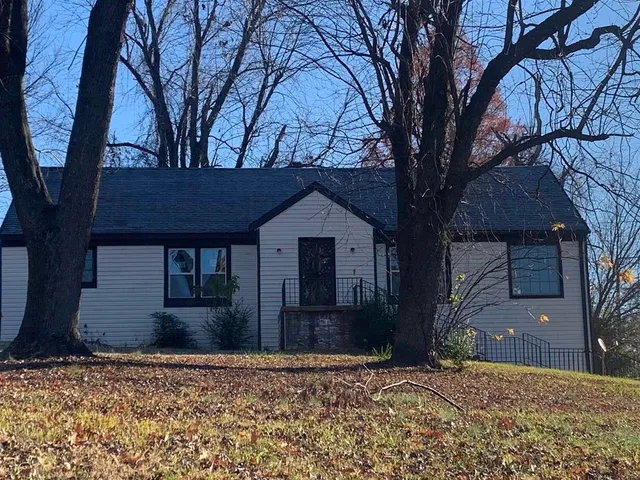a house with trees in front of it