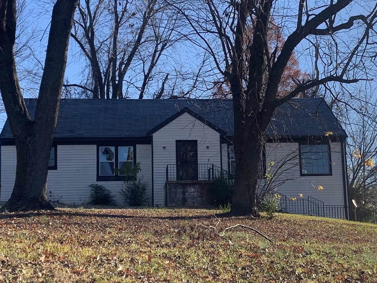 a house with trees in front of it