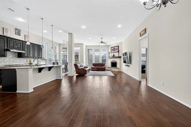 a view of a dining room with furniture and window