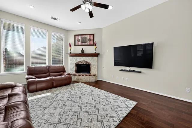 a bathroom with a sink a toilet a mirror and shower curtain