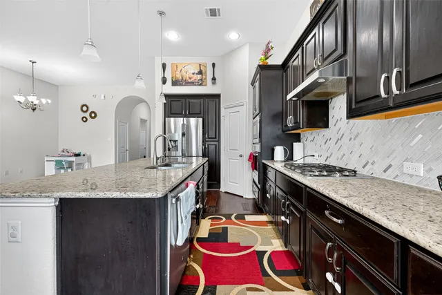 a view of a bedroom with a bed and a window
