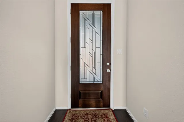 a open kitchen with stainless steel appliances granite countertop a refrigerator a oven a stove and a wooden floors