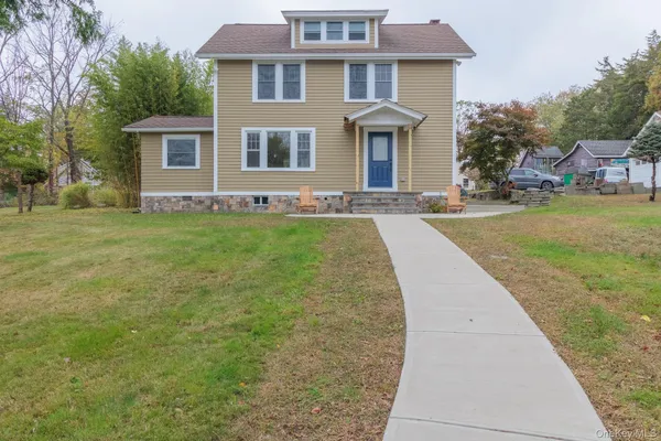a front view of a house with garden