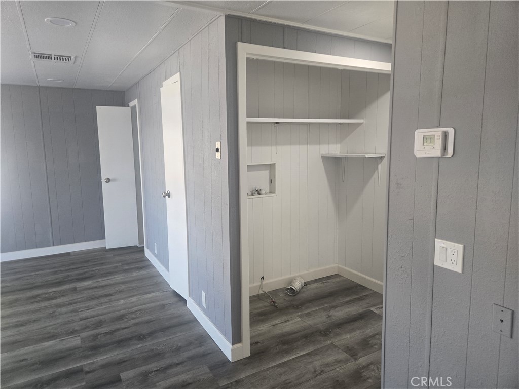 1700 State, Unit 13 Hemet, CA 92543 - Photo 4 of 13 a view of a hallway with wooden floor