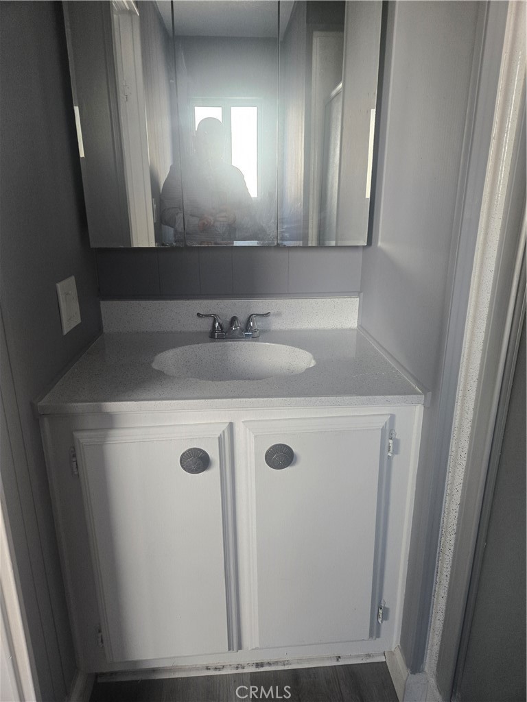 1700 State, Unit 13 Hemet, CA 92543 - Photo 7 of 13 a bathroom with a sink and a mirror