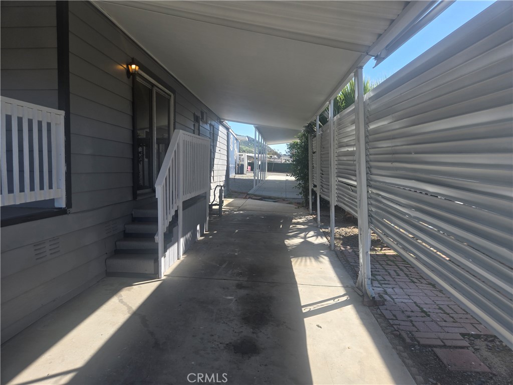 1700 State, Unit 13 Hemet, CA 92543 - Photo 10 of 13 a view of a balcony with chairs