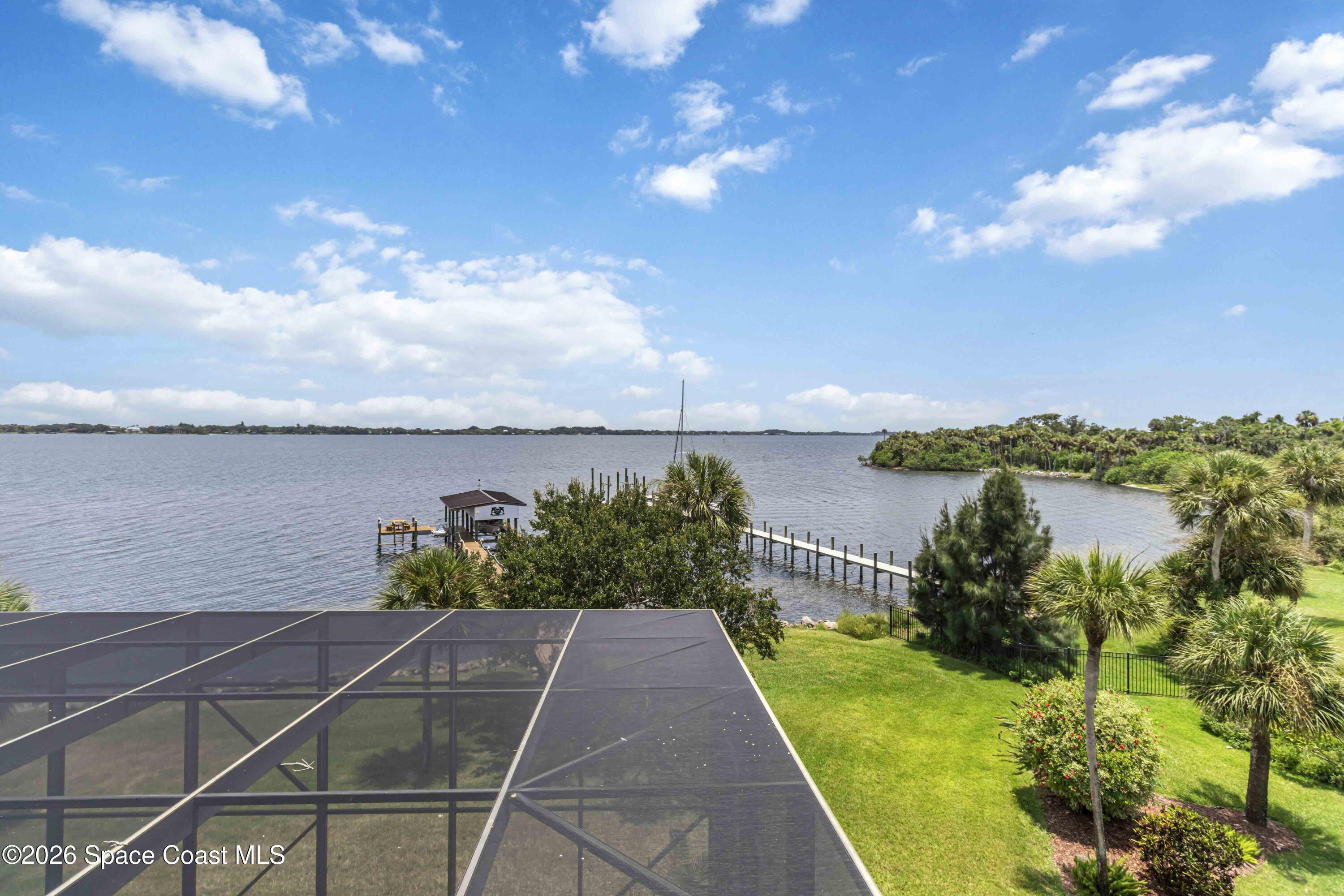 110 Barnacle Place Rockledge, FL 32955 - Photo 62 of 71 a view of a lake with a garden